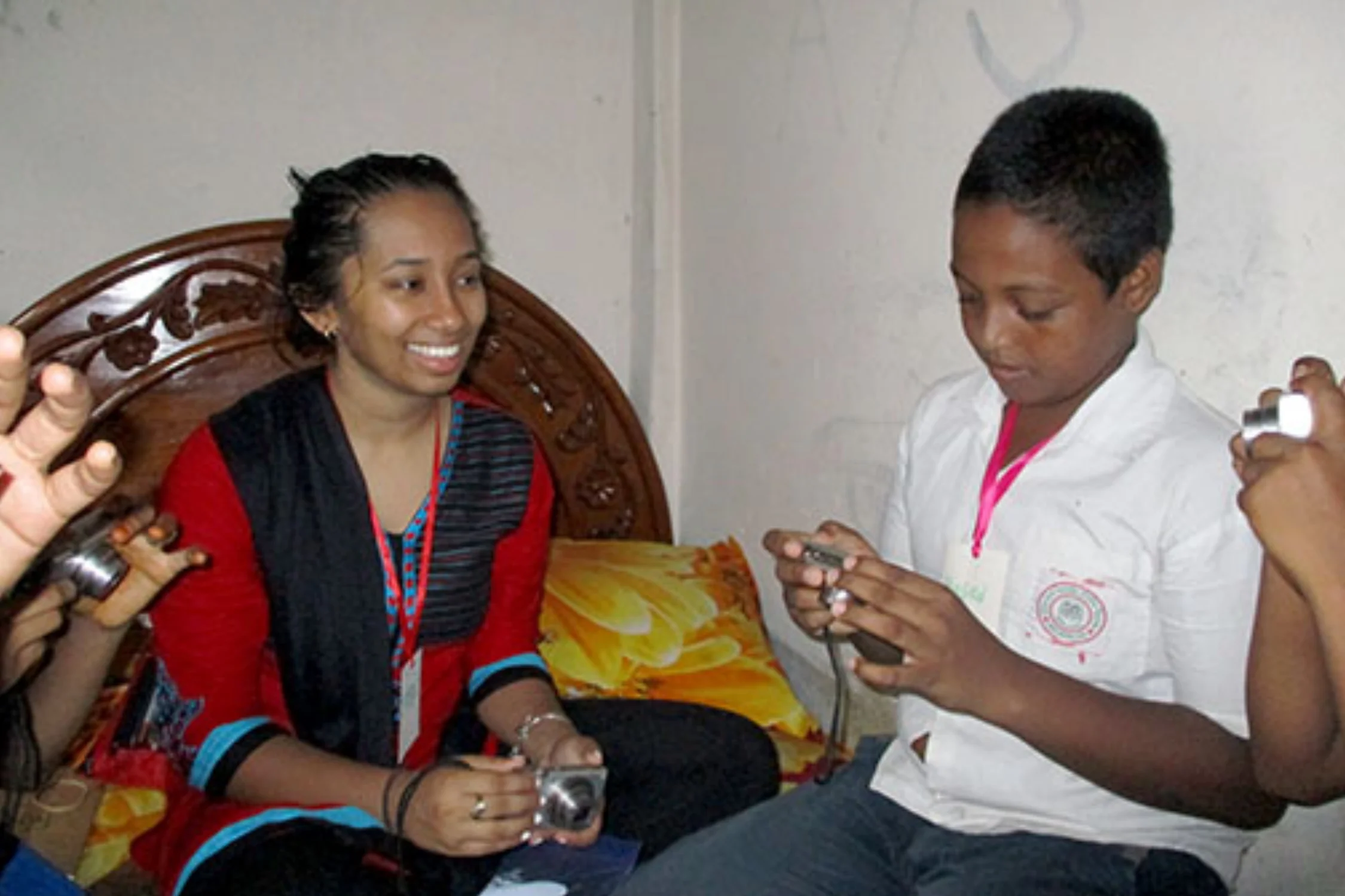 Mehran covers camera settings with her group, taken in one of the students’ family home in the Nuru Chala neighborhood.