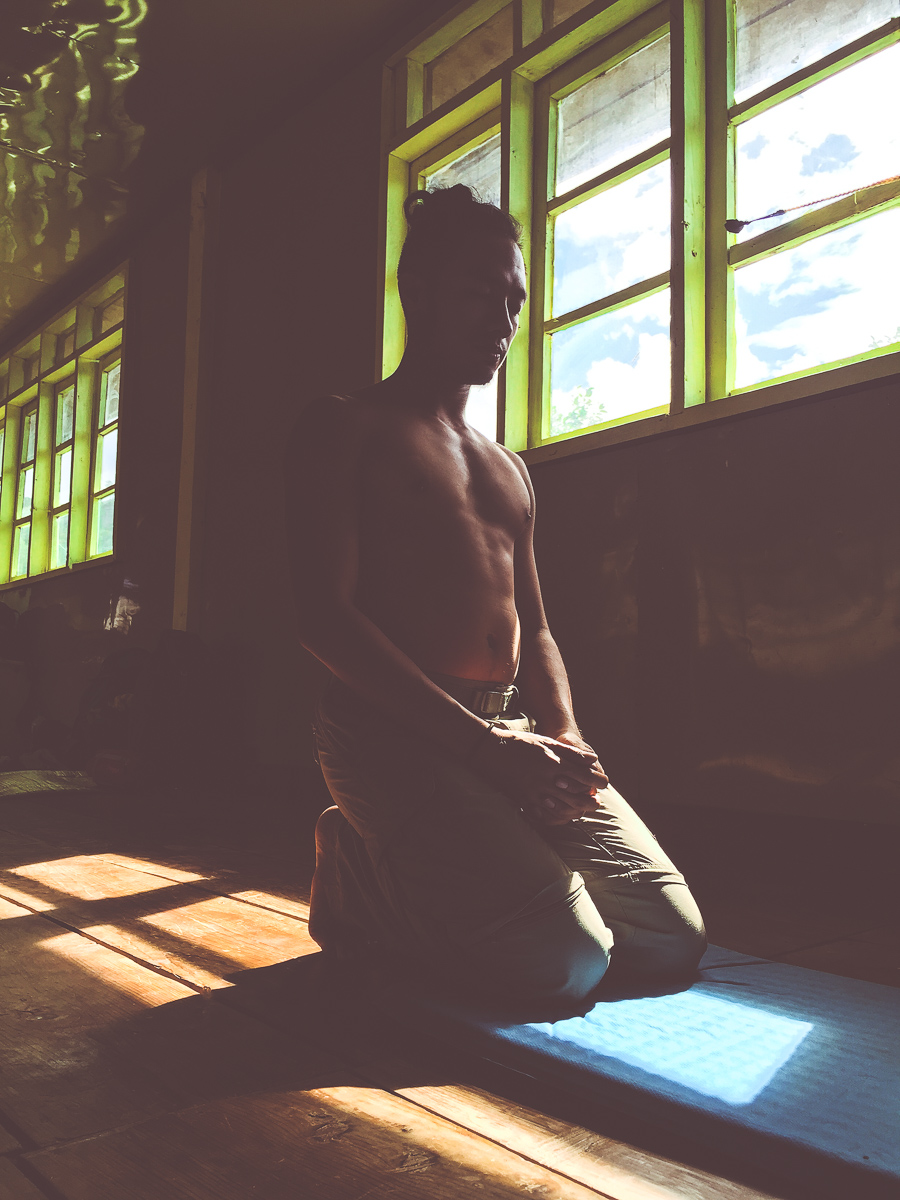 Recovering from the long walk in our large classroom in Domolpos. My buddy EJ Angeles took this photo because he saw a "samurai doing yoga." :s