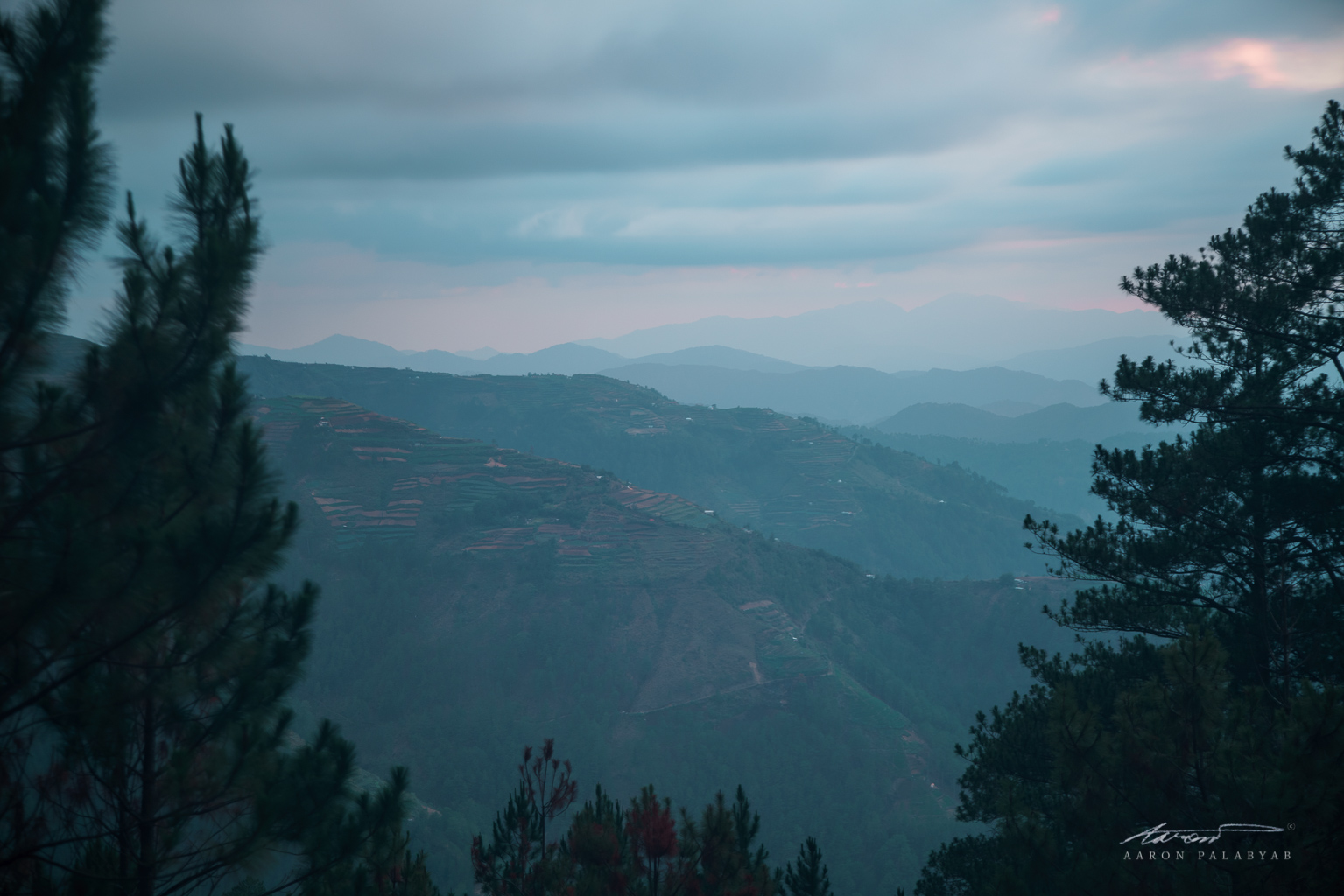 Dusk descends on Marlboro Camp. In view are the high rice terraces that mark the start of the beginner-friendly Ambangeg Trail.