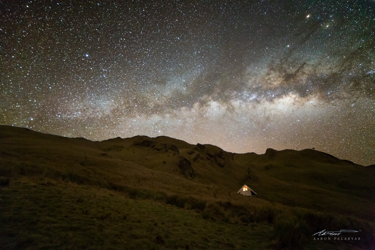 Looking up at the Milky Way and the summit of Mt. Pulag. Sony A7RII + Samyang 14mm f/2.8, composite of a 2-minute and a 15s exposure, ISO 6400.