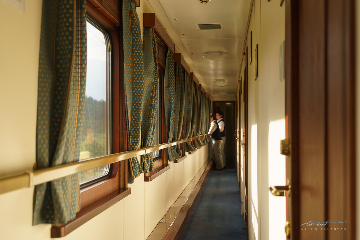 The hallway outside the Deluxe Gold cabins and our carriage's cabin attendants enjoying the scenery