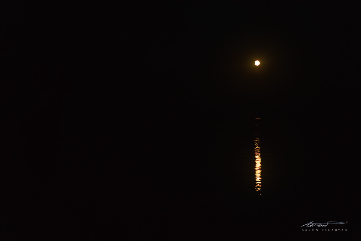 The full moon rising over Lake Baikal