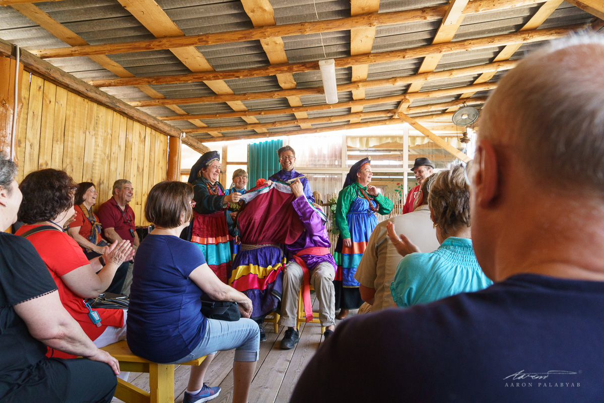 Breaking into laughter while demonstrating an Old Believer wedding ceremony