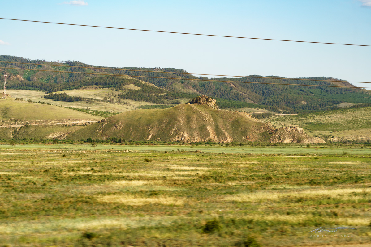 The hill where we stood just a few hours ago, as seen from the train