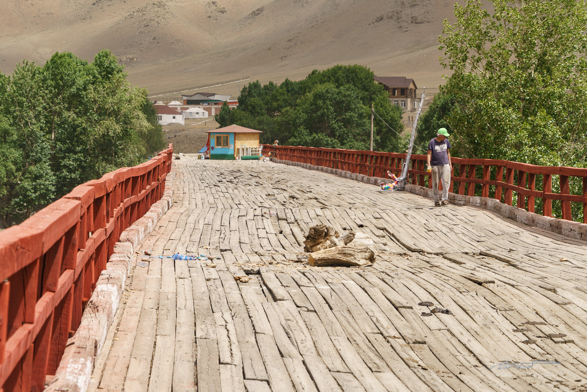 Wavy planks on an old wooden bridge