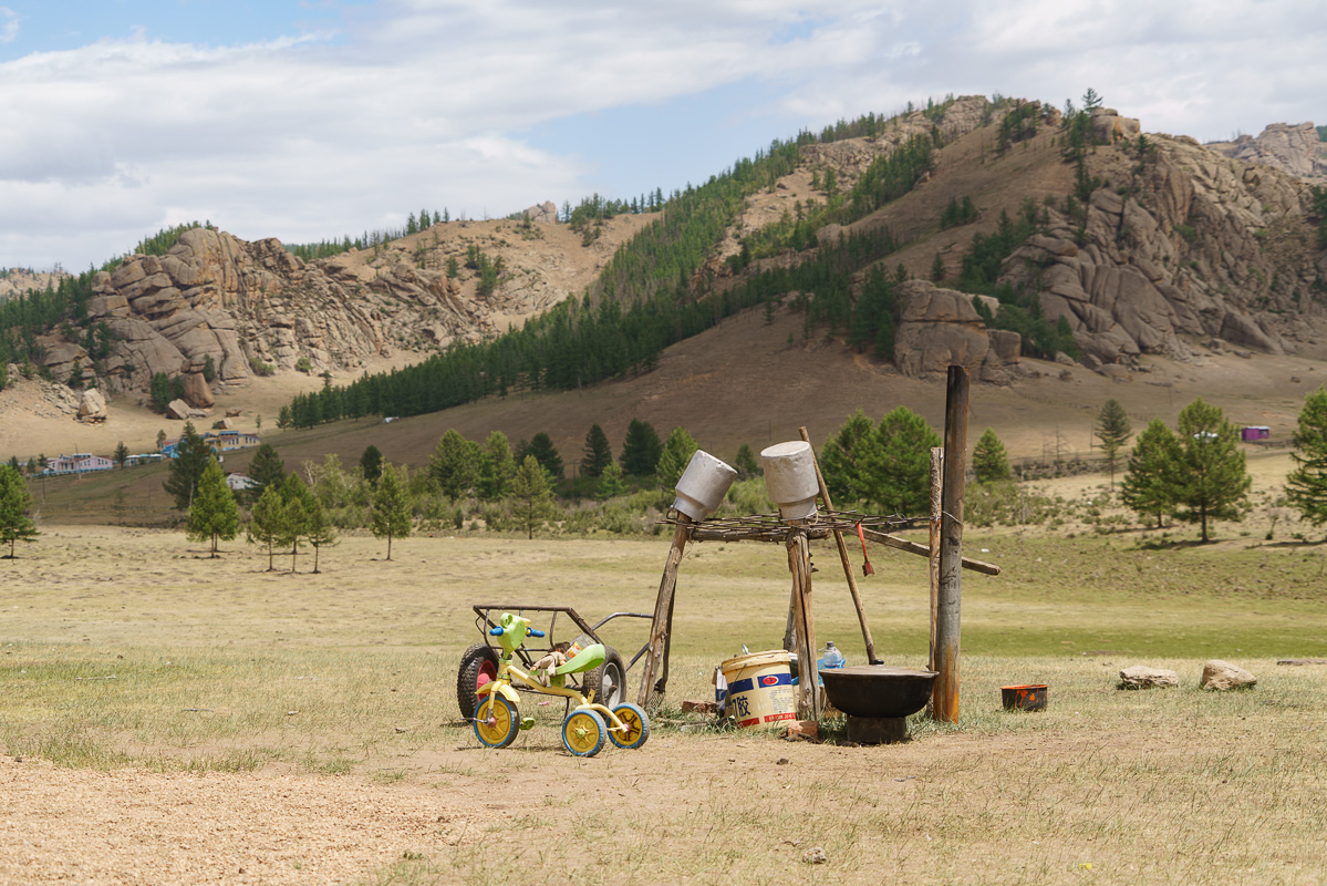 Camp scenes against a dramatic backdrop