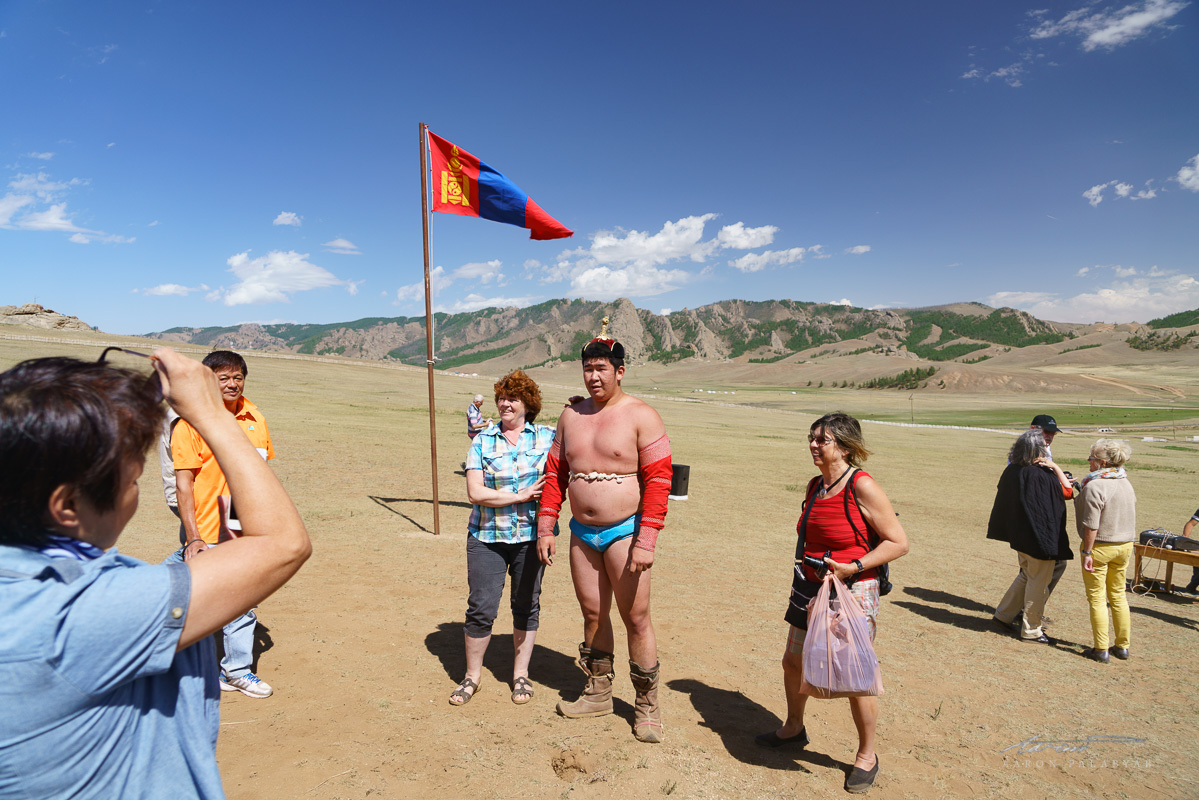 The champion of the wrestling tournament with his adoring female fans