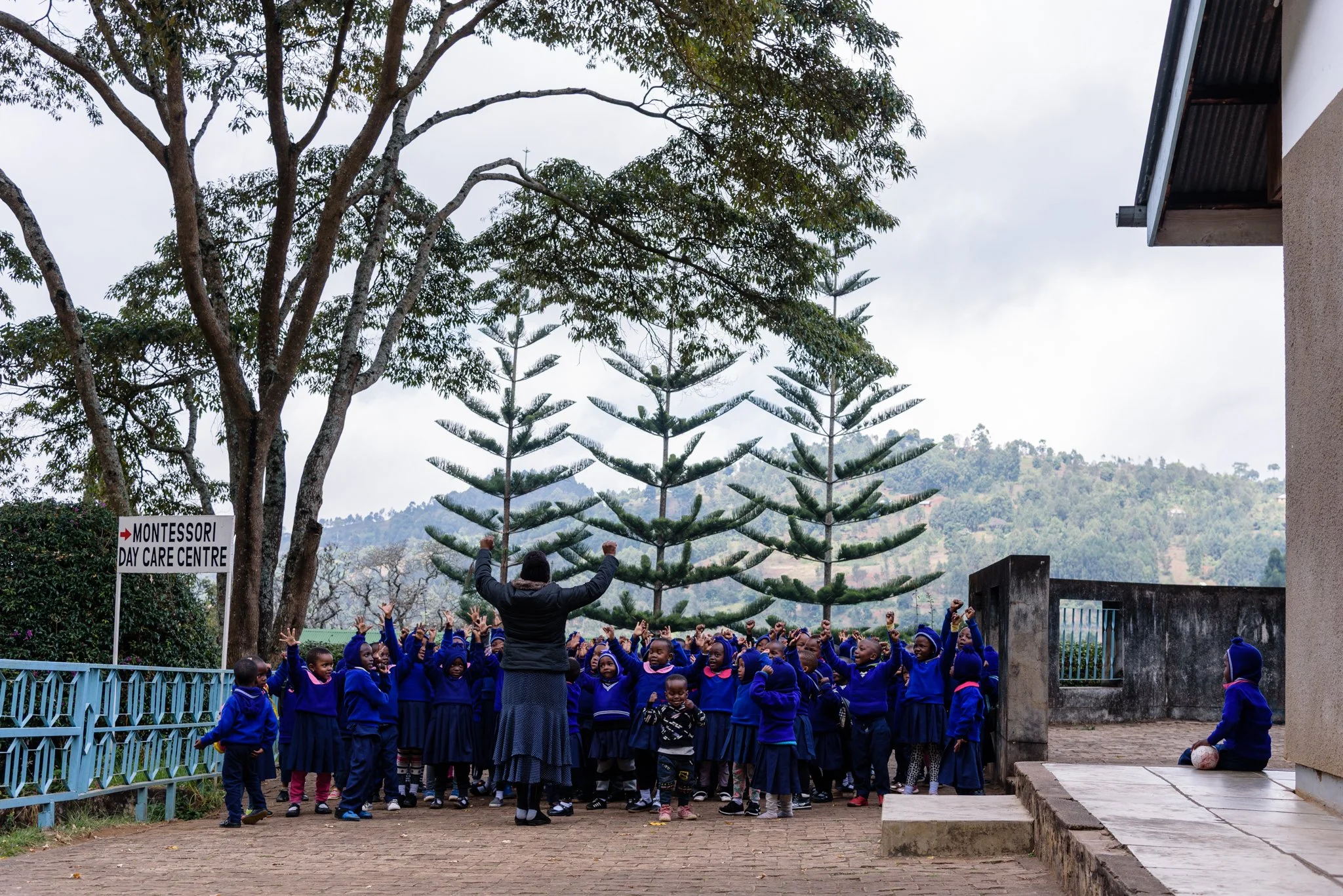 Students doing physical exercises after having porridge before returning to their classrooms in Lushoto, Tanga Region, Tanzania.