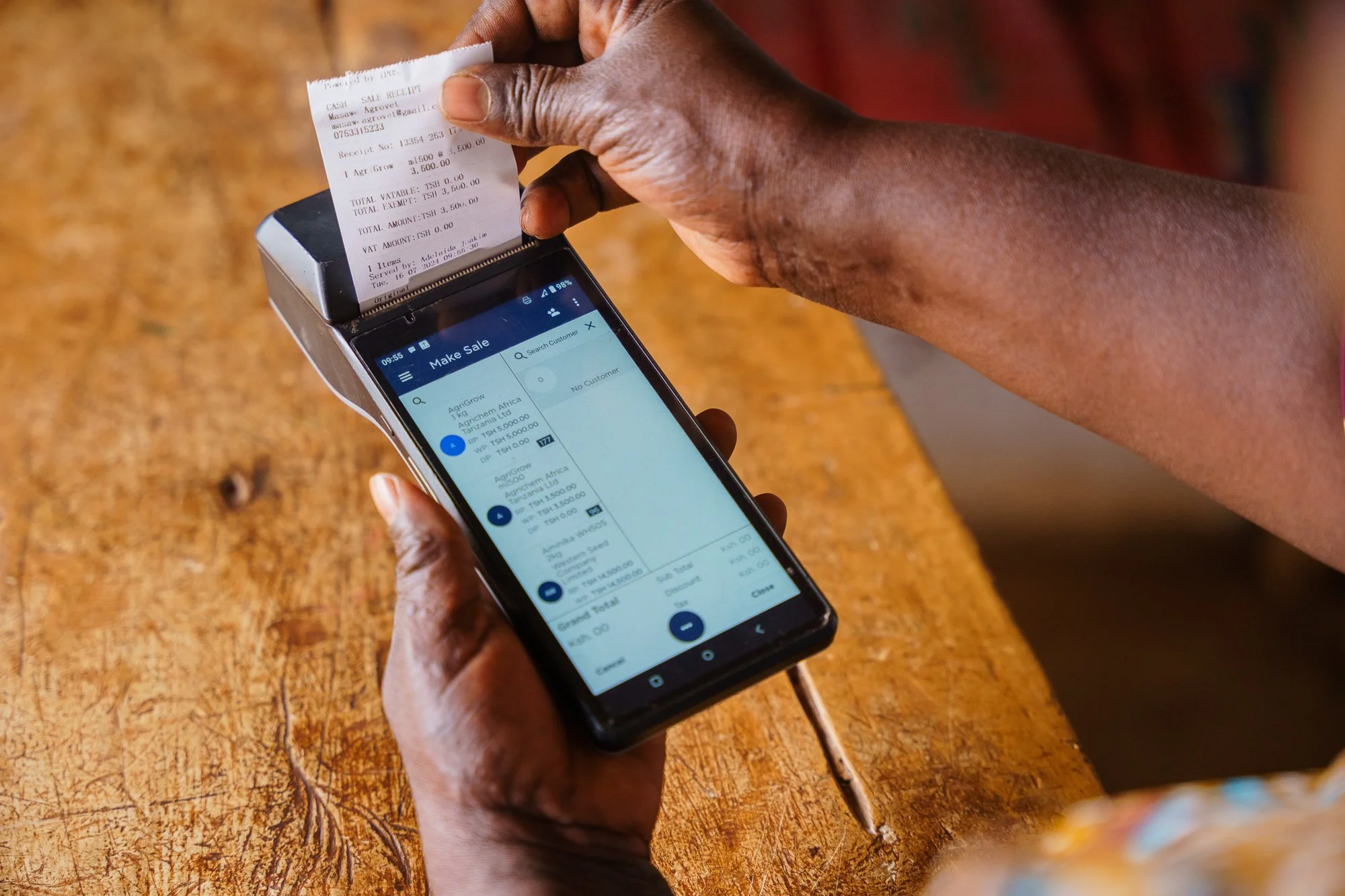  Adelaida Joakim using POS in her shop. 