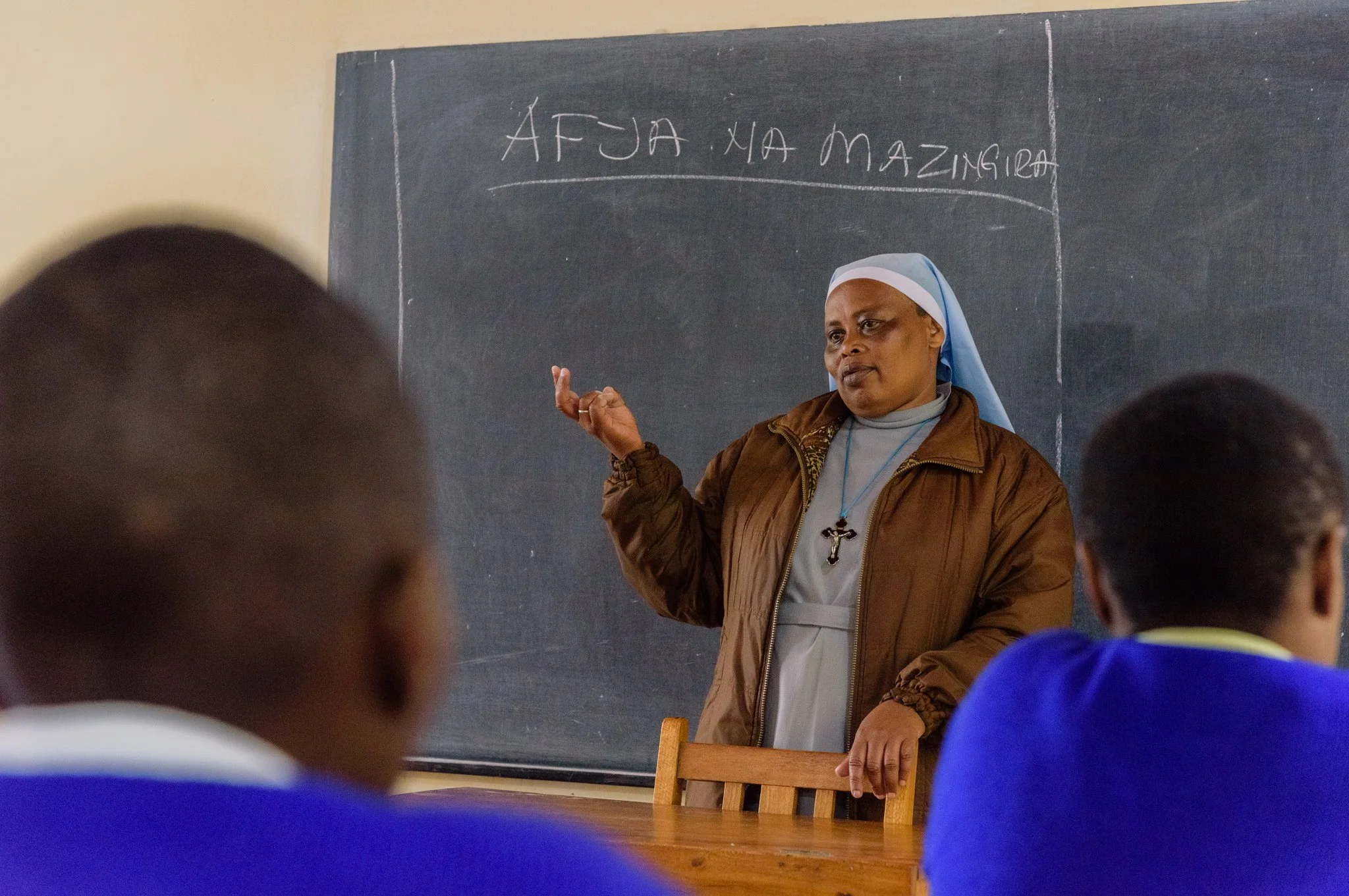 A nun instructing students inside a classroom at the Montessori Training Centre in Lushoto, Tanga Region, Tanzania.
