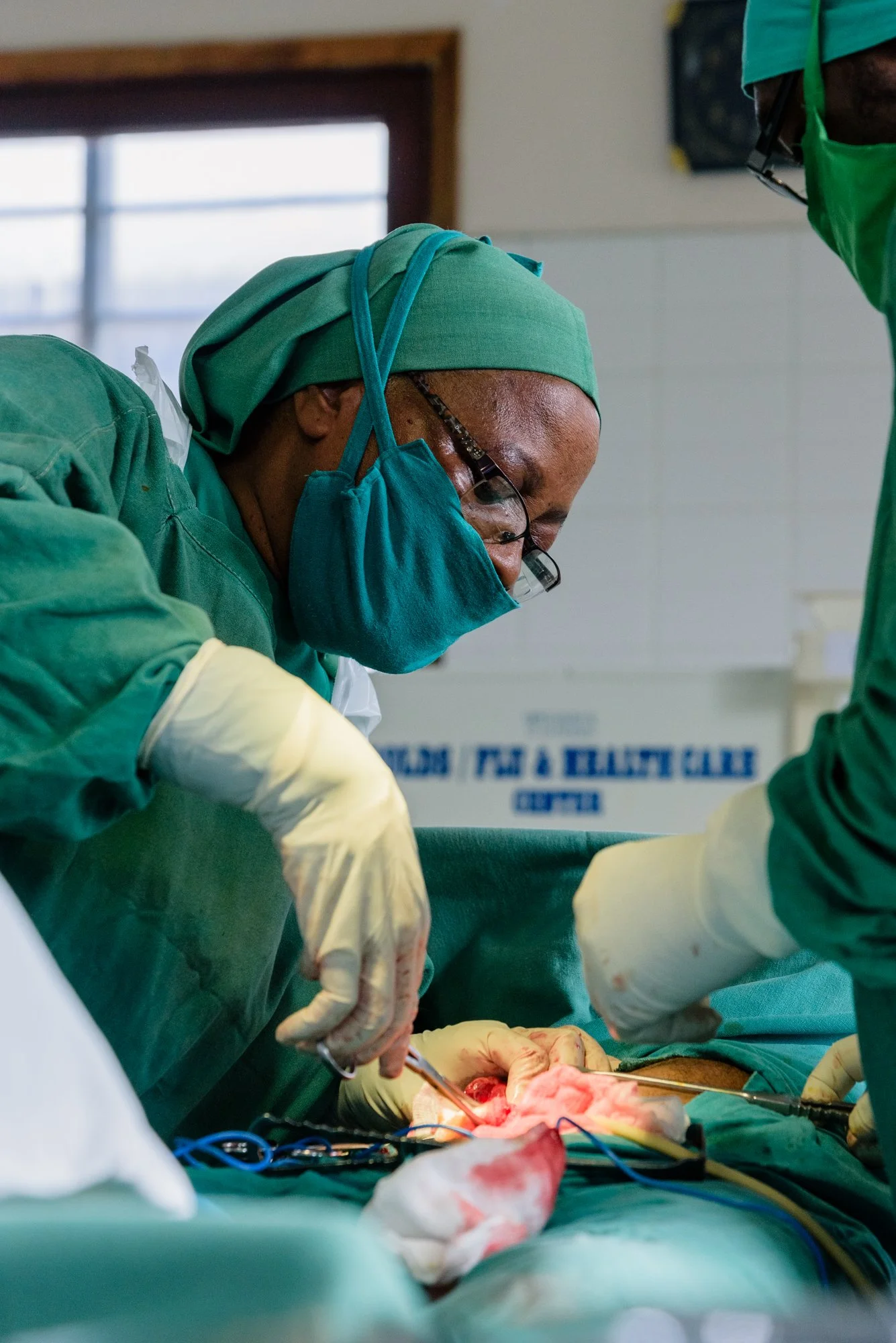 Medical team performs surgery inside an operating theatre at a hospital in Korogwe, Tanga, Tanzania.