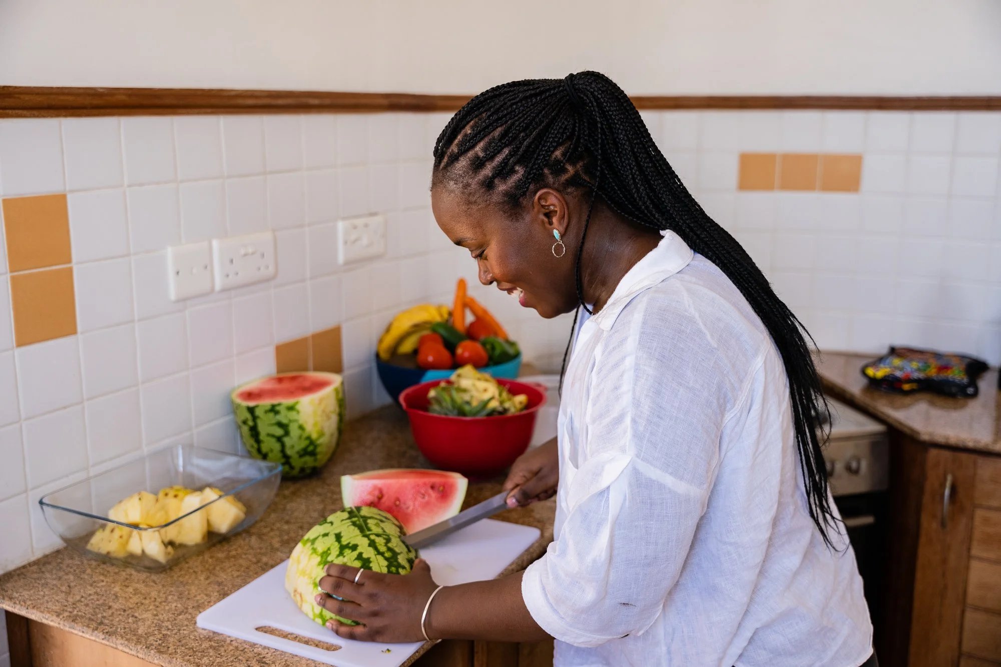 AKFC International Youth Fellowship participant preparing food in Dar es Salaam, Tanzania.