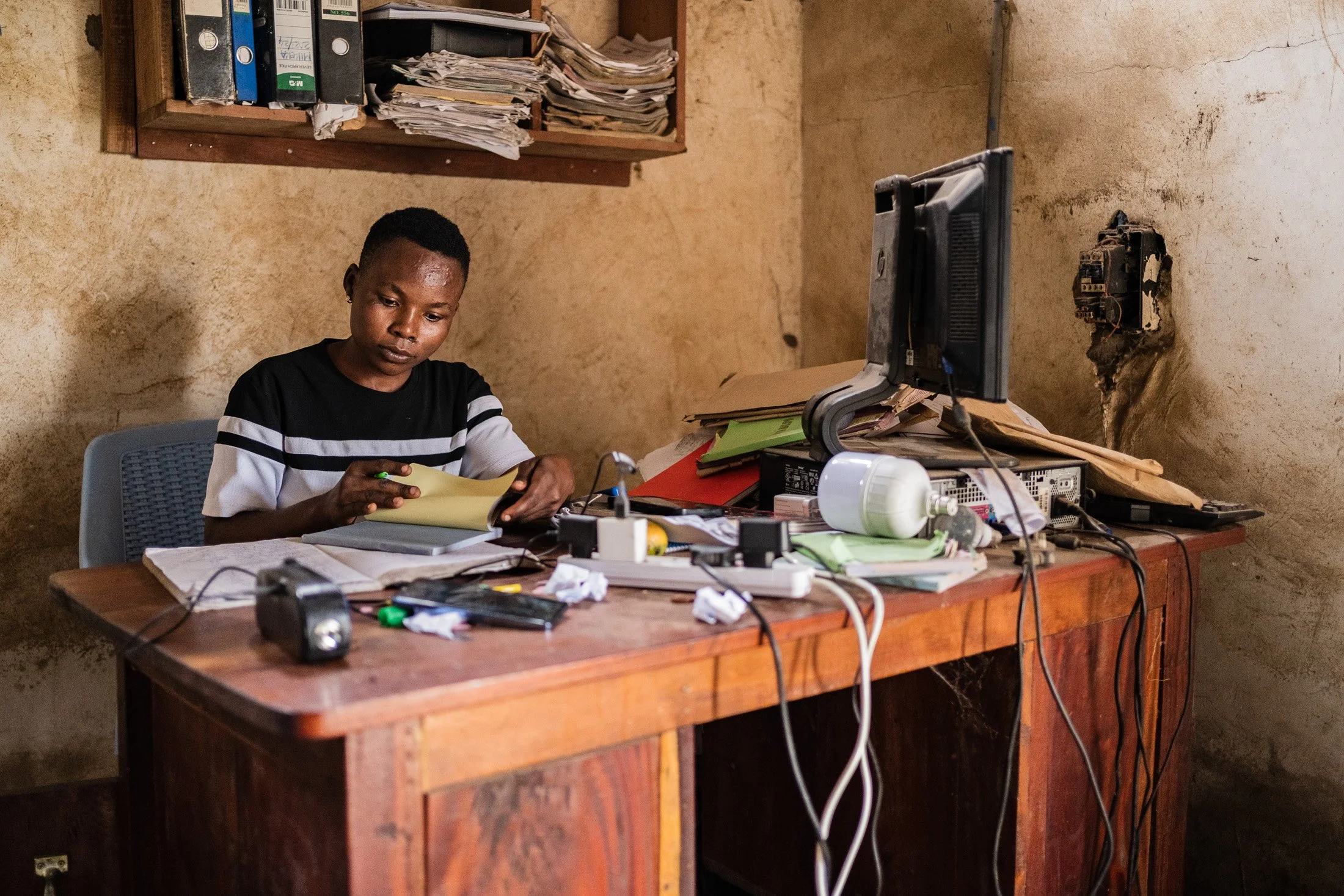 Administrative work supporting cocoa production and trade in Mababu Village