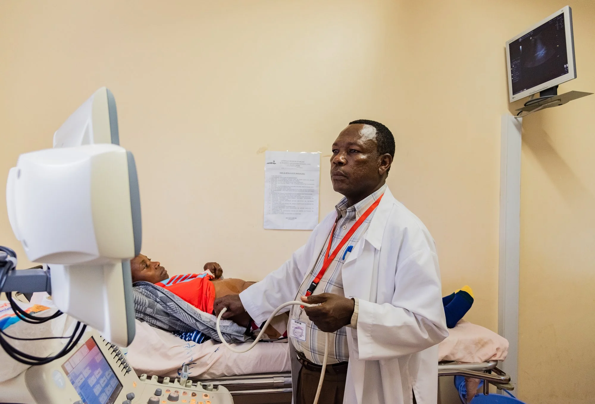 Doctor conducts an ultrasound examination on a patient in a hospital in the Kilimanjaro Region, Tanzania.