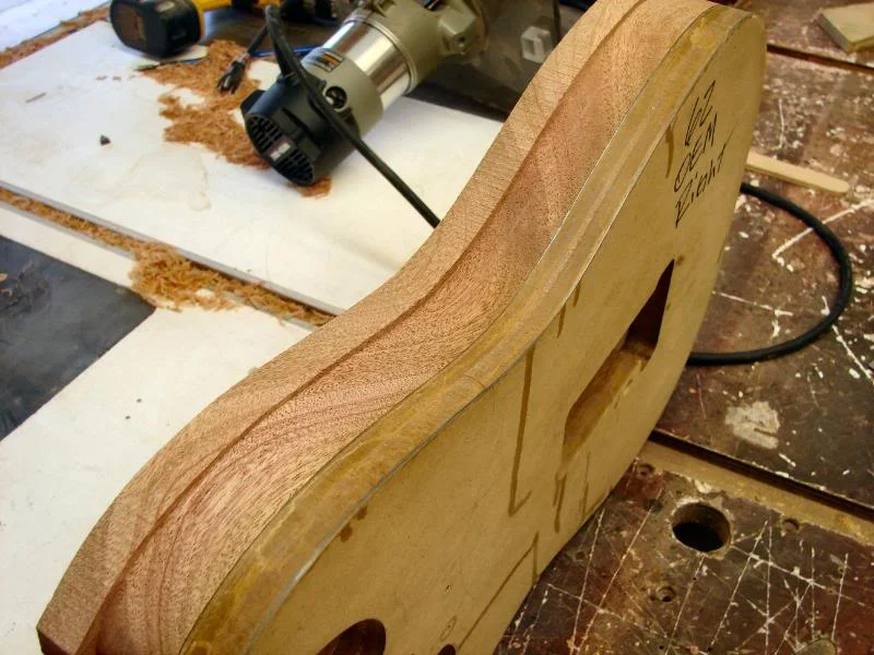 The reason I only do half on one edge is I want to rout the tremolo spring cavity while the template is mounted. I will also drill the neck bolt holes too. Once that is done I am through with that template.