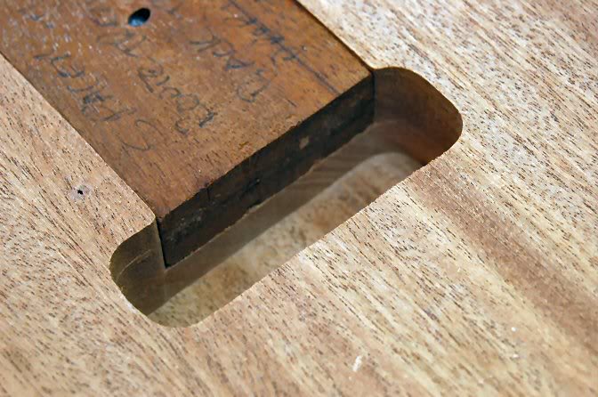  Now lets finish the spring rout. I place a block in the slot, and use a top bearing pattern tracing bit. Rout ½ of the remaining wood from the cavity. 