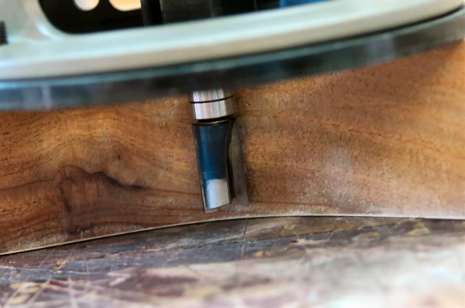 Then lower the bit to leave 1/8th inch remaining and rout the remainder.
