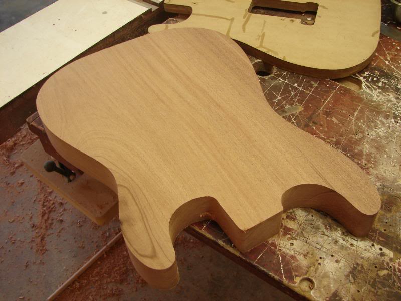  So here is where we are. This body will have a book matched Flame Maple Veneer applied, so first, I have to do the arm contour. 