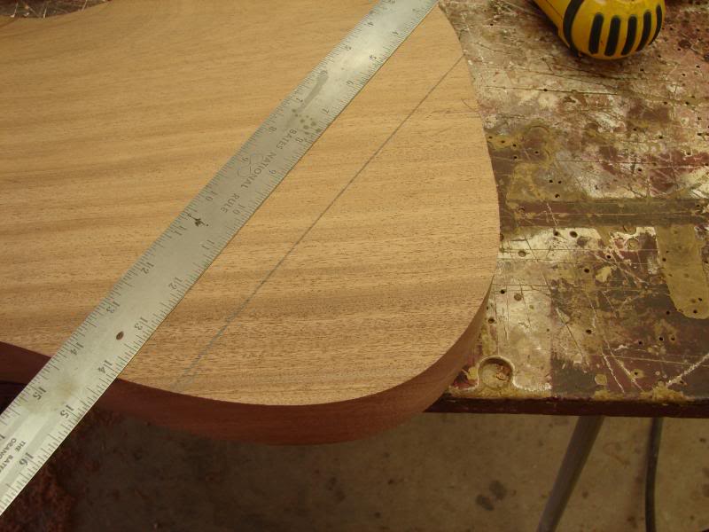  I indicate that approximate area I want to have the contour roll into the flat top.&nbsp;Remember, the contours are NOT compound. They are flat on one axis while rolling on the other. If you think of a large flat sanding surface, and held the body a