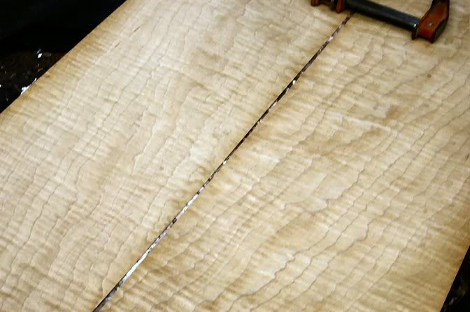 Once the top contour it perfect, it’s time to move on. I select two sheets of Maple Veneer and begin matching it. Book Matched lumber rarely is, so you have to work with it to get the perfect alignment.
