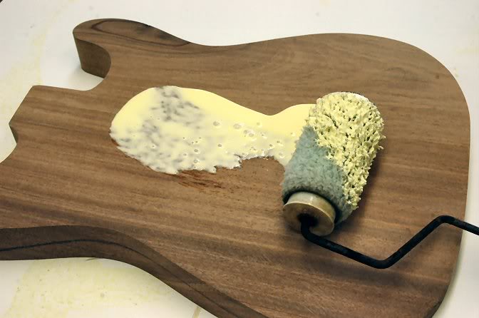 And glue it all up. I use good ‘ol yellow wood worker’s glue and a small paint roller. The secret to quality veneering is good complete glue coverage. I roll it on the body first, because it won’t curl up on ya, then on the veneer.
