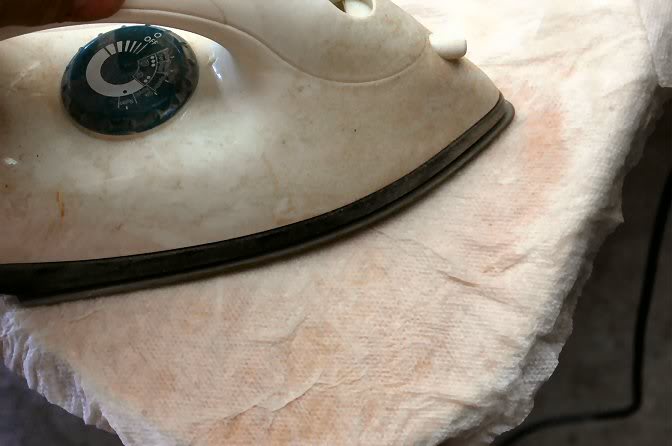The blankets of rubber can leave their pattern on the surface of the veneer, so I’ll take a wet paper towel and Iron it. This forces the steam into the wood’s fibers causing the compressed veneer to swell.