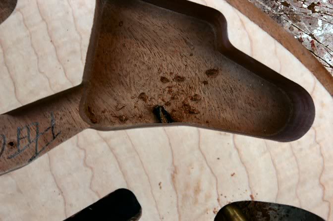 Just be very careful. The wood is very thin here and it’s quite easy to punch through to the back side. Also, I forgot to photograph it, but drill the relief inside the jack rout for the phone jack.