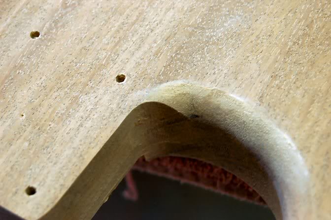  On the back, where the horns meet the neck pocket heel, stop short of the heel, the remaining wood gets hand shaped. This is before... 