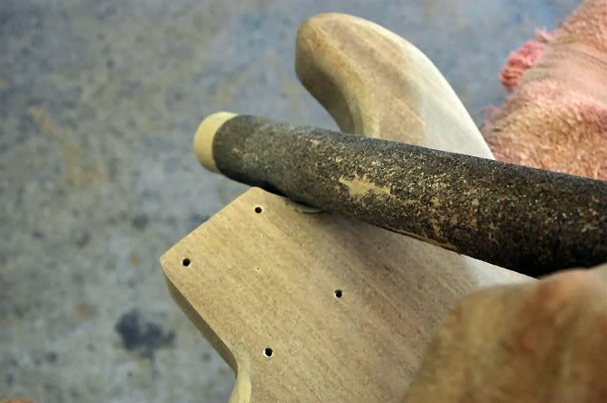  For the lower horn, I use a larger diameter sanding stick (technical term). 