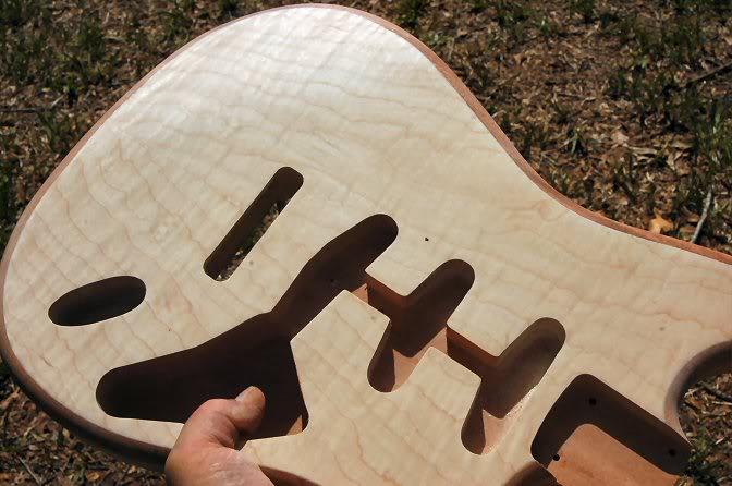 Once you’re sure it’s all sanded, check in the sunlight again, and again, particularly if you’re doing a transparent finish. If not you could have squirted sealer a long time ago.