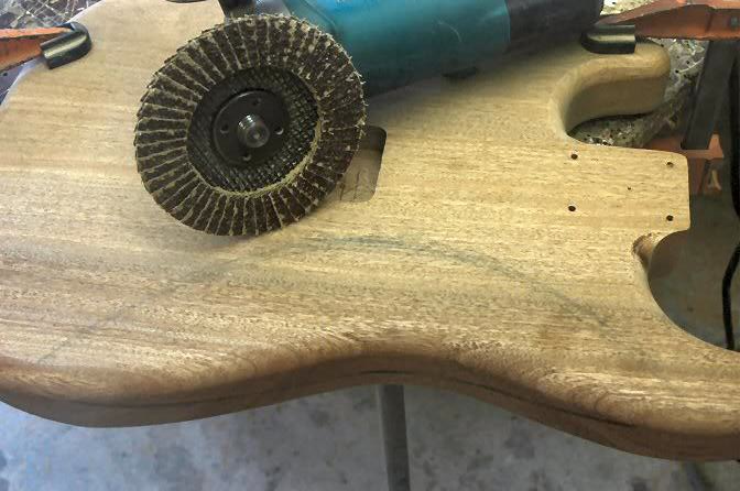 Now, to the back, the tummy contour. Again the same delicate little tool and the finesse necessary to remove what doesn’t look Stratesque. I mark the approximate extremities of the contour and remove wood until I get close.
