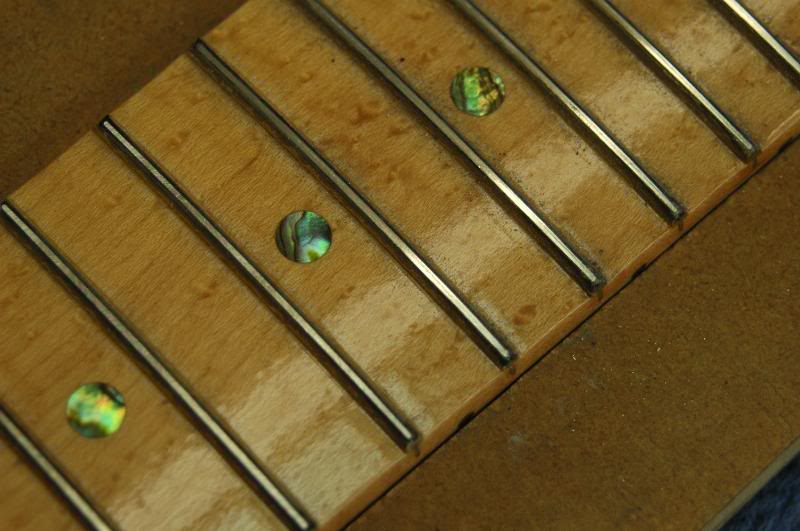  Continue on each fret until the scratches from the fret leveling tool are ALMOST gone. Just a faint hint should remain. Do all the frets the same way.&nbsp;They should all look like this. 