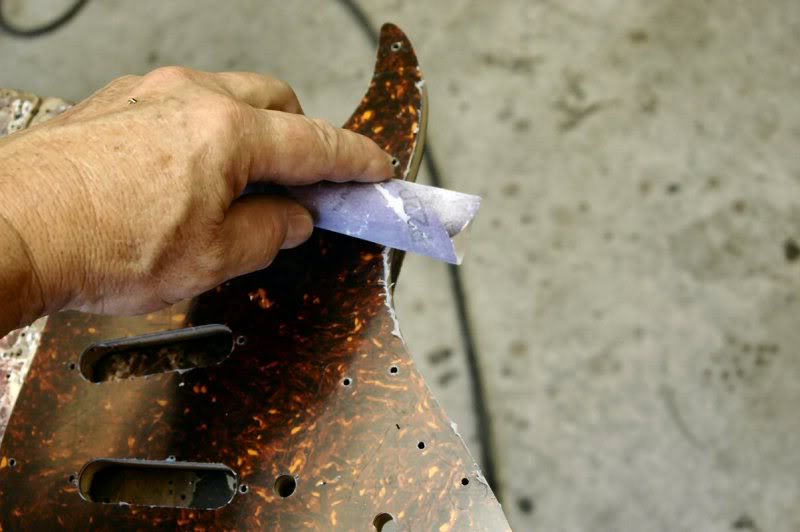  Now I take a piece of sandpaper and go around the edge to remove any of the “fuzzies” the routing left behind, because cutting the bevel requires a very flat surface, the plastic can throw things off. 