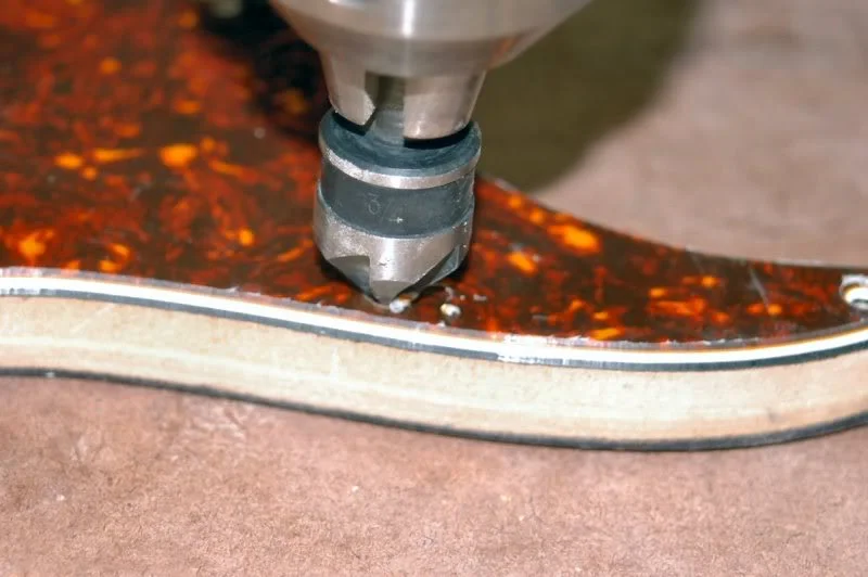 Now back to the drill press and countersink the screw holes.