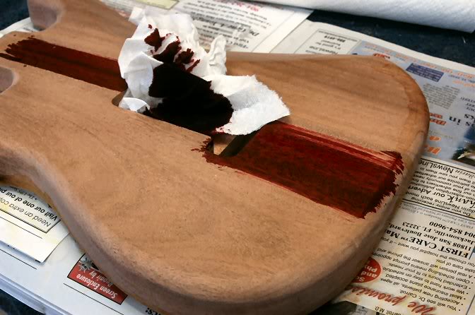 I can’t stop to show the steps because this is an alcohol based dye, and dries at light speed, so there isn’t time to clean hands, find camera, focus, shoot, and resume. By that time the stuff’s dry and streaks would happen. But I stain the wood, while you can tint the lacquer (I do that too) by staining the wood first, the grain really pops out. So yellow on top, red on the mahogany on back.