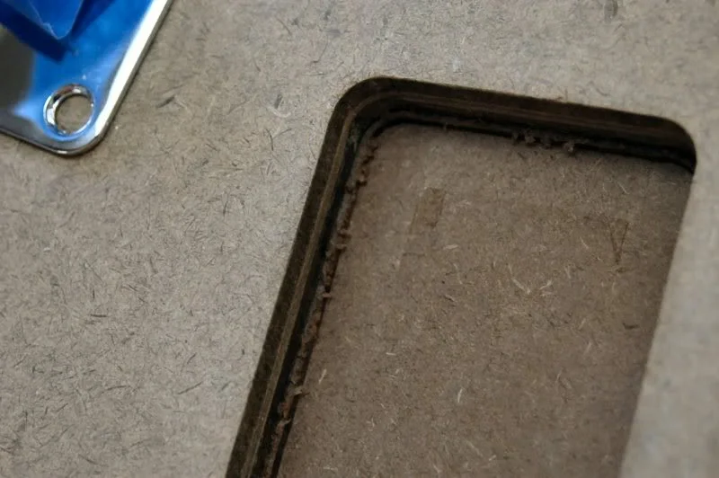 Now, since I’m on a roll, I move on to the neck plate. I rout a test in the scrap.