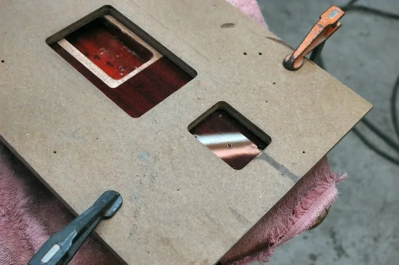 Then locate the template over the plate, leaving the inside margin equidistant and clamp it in position. And yes a side note: lacquer is brittle, so when you clamp the templates, do it with only enough pressure to secure the template, if you go torque crazy here, you will be refinishing the whole body.