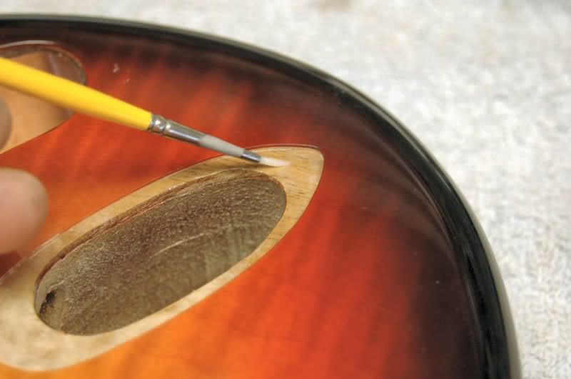  This gives it a fighting chance if anything wet hits the guitar, If left open, the water could soak into the grain, and cause the underlying wood to swell. Not a good thing.   