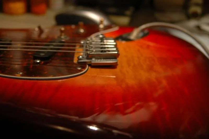 Now that the springs are used to their new life under constant tension, I adjust ‘em to get the tremolo approximately level with the surface of the guitar.