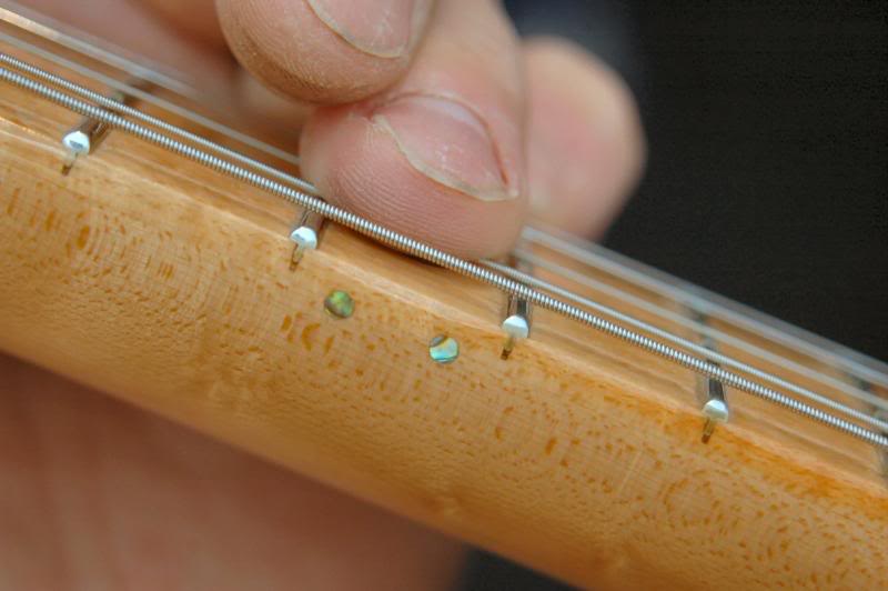  One of the last things I do is play an Em scale. For some reason, if there is “Stratitus” or the pickups too close to the strings pulling the 6th into an asymmetrical wave, I can really hear it ... Perfect.    Click here to return to Builds  .   