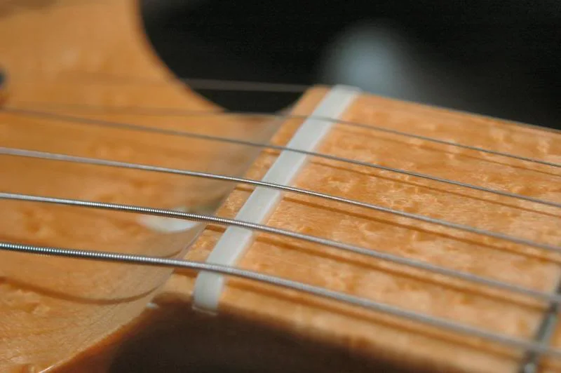 Replace the strings and the pressure will seat the nut. With that, this baby’s done.