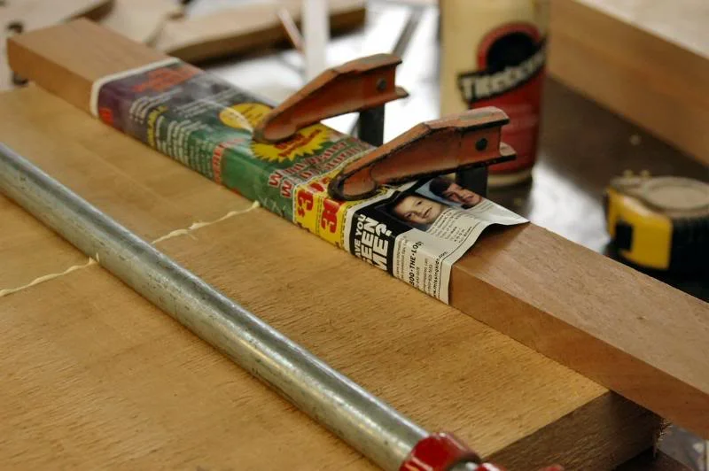 Since the edges are jointed at an angle, I cannot simply clamp them as per normal because the wet glue acts as a great lubricant and the pieces will slip apart, so additional support is required to keep everything planar until the glue dries.