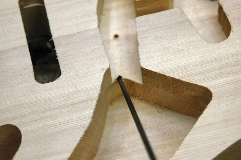 Remove the block from the Pickup rout and we’re done. At this point I will drill a few necessary holes, the ground wire between the cavities...