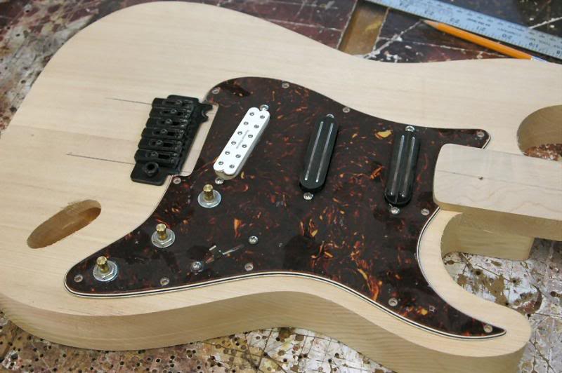  Then place the loaded pickguard and a Tremolo, and see where everything falls, if all is good, let’s get ‘er done. 