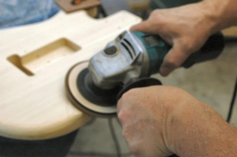  Using pretty much the same method as I did on the top, I use the grinder to coarsely remove the wood down to the approximate depth. I stand there and hold the grinder firm with my elbows anchored in my sides, and rotate from the waist; this makes it