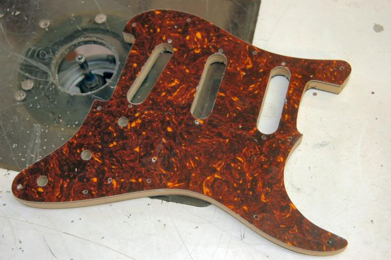  It now looks strangely like a pickguard. Next, the beveled edge… 