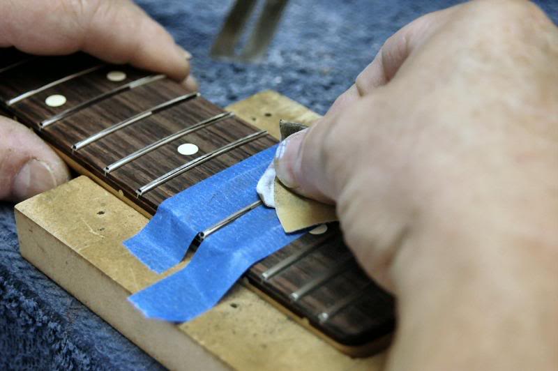  To protect the fingerboard, tape works well too. 