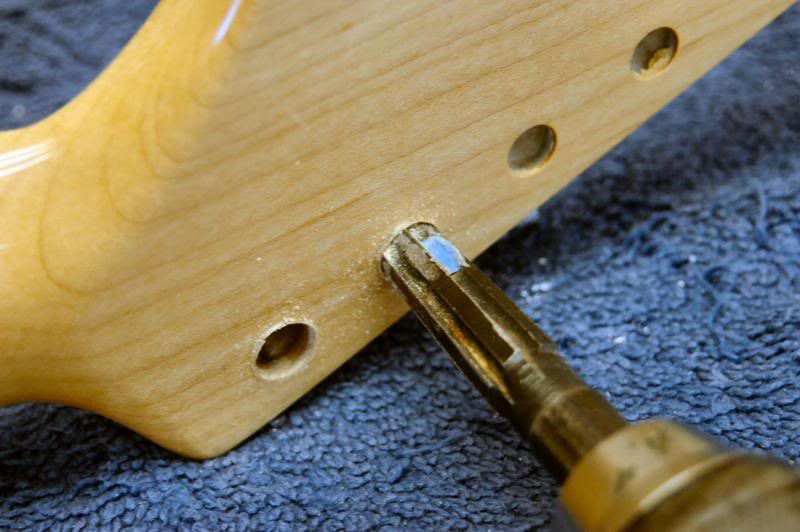  Even if you ordered your neck drilled for the specific keys you are installing, you are going to find they will still need reaming. For Kluson vintage style ream the face until the ferrules slide about ½ way in. For Schaller and Sperzel, ream the ba