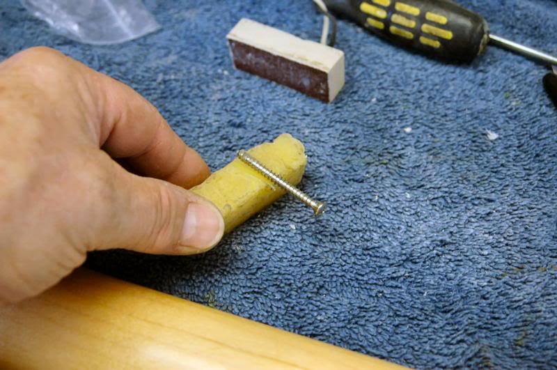  Add a bit of bee’s wax, and carefully run the screws in. As the heads come into contact with the neck plate, I watch carefully and gradually work the screws in, allowing them to work against each other, so they will seat perfectly center. 
