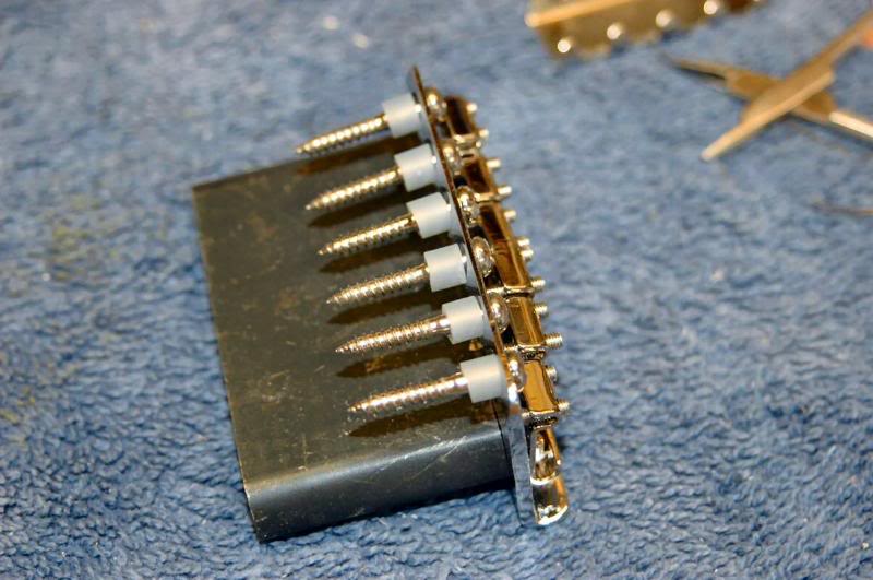  Drill your pilot holes and mount the tremolo. This is a Wilkinson Vintage Trem, steel trem block, a great tremolo. 